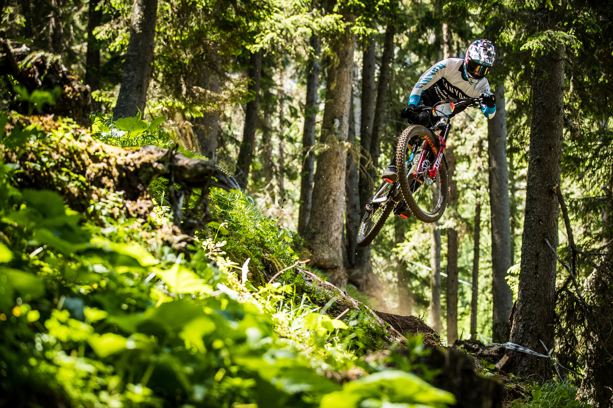 Florian Nicolai boosts over a section of trail.